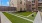 Outdoor lounge at our apartments in Addison, featuring astroturf, outdoor couches, and string lights.