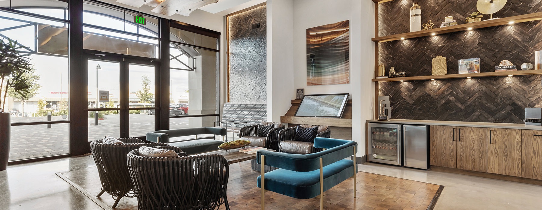 Spacious and well lit lobby with ample seating, tile floors and large windows